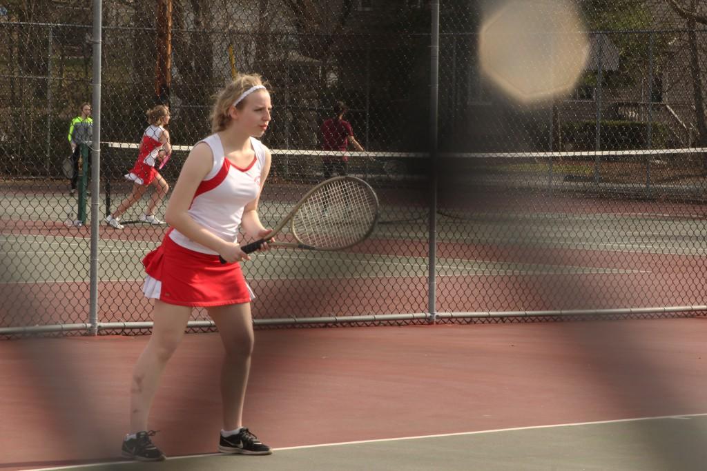 Sophomore Abby Gillespie warms up in doubles against Shepherd Hill on March 31. | by Alyson Haley