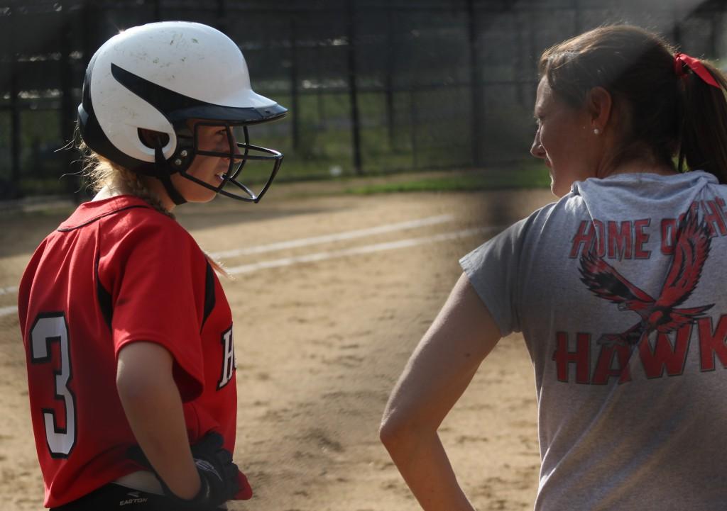 Junior Sydney Chiasson talks with Coach Mary Beth Cashman before Tuesdays game. Hudson would lose to Doherty 3-0 ending their season.| by Dakota Antelman