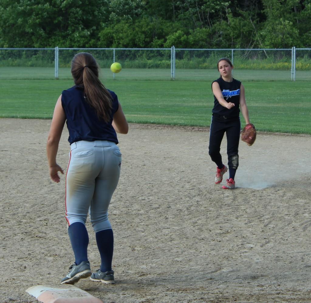 Keeliey Zompetti throws a ball to Haley Gaffney during practice. | by Dakota Antelman