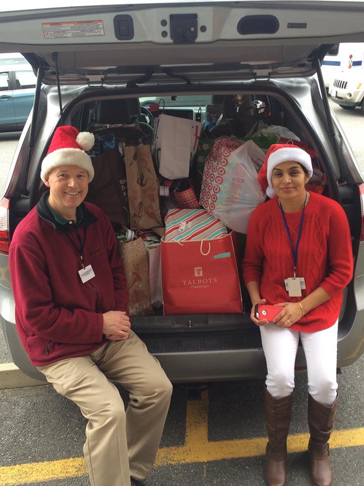 High and Pabitra Neupane, another worker at Ascentria, getting ready to deliver Christmas presents to all the refugee children who arrived in Worcester in 2015. | Submitted Photo