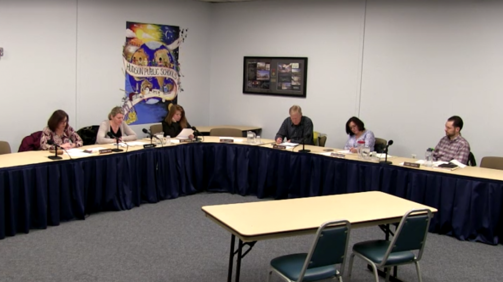 School committee chairperson Michele Tousignant Dufour names the four finalists for the Hudson superintendent job at a meeting on March 7. | Photo courtesy HudTV