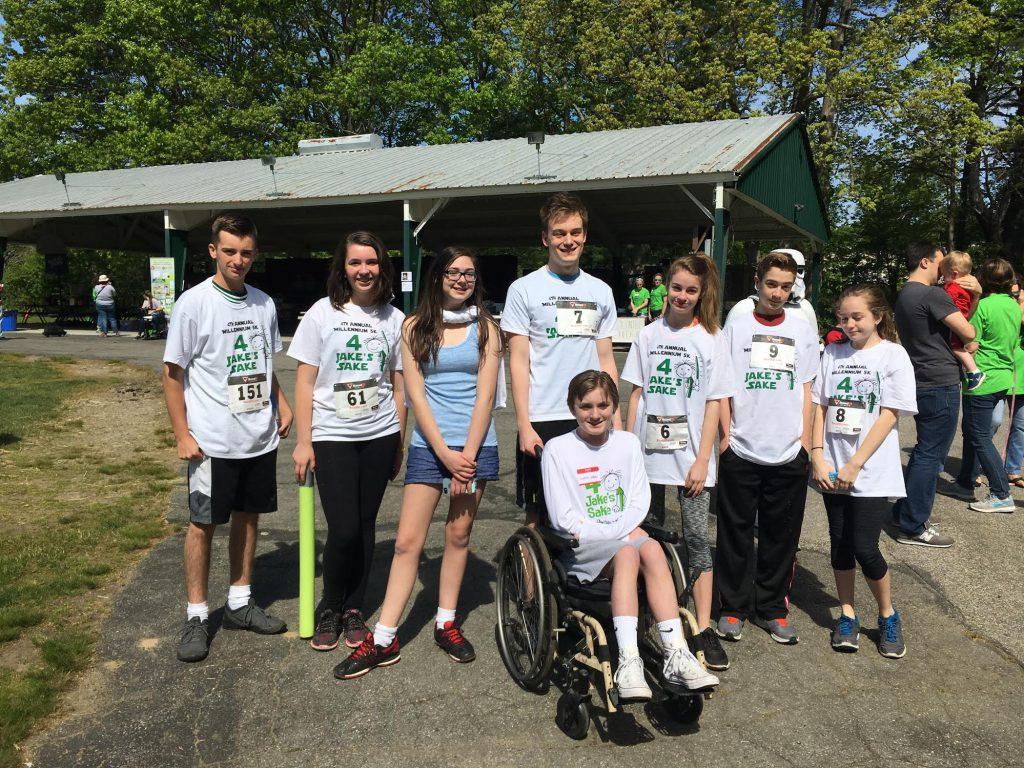Jake Marrazzo (Center) surrounded by friends as they participate in the 5K