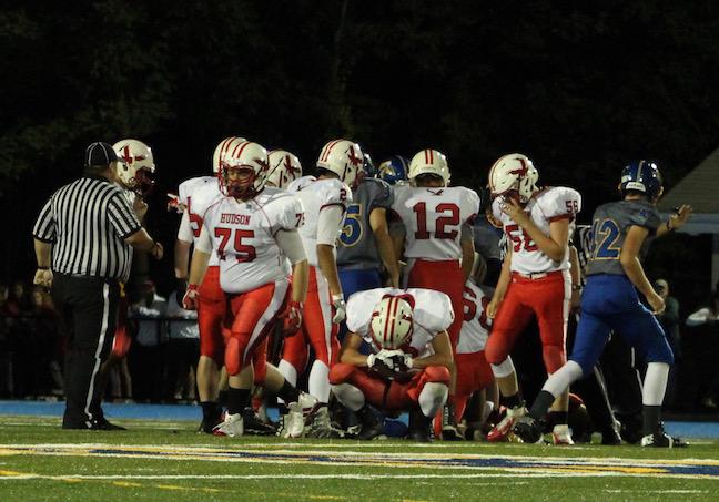 The Hawks appear frustrated after Assabet recovers another fumble. | by Siobhan Richards