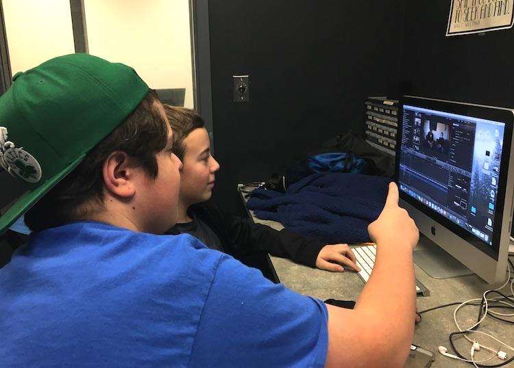 Junior Pat Fortuna and eighth grader Charles Togneri edit a film at HUD-TV. | by Clement Doucette 