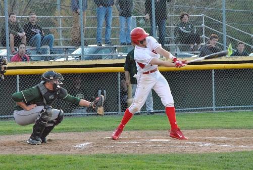 Hudsons Thomas Hydro swings and misses on a pitch early in the game. Though hitless at the plate, Hydro did enter the game in its later innings as one of five pitchers to take the mound for the Hawks. | by Dakota Antelman