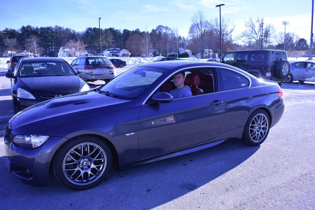 Hatch sits in his car posing for a picture. | by Ariana Jordan MacArthur