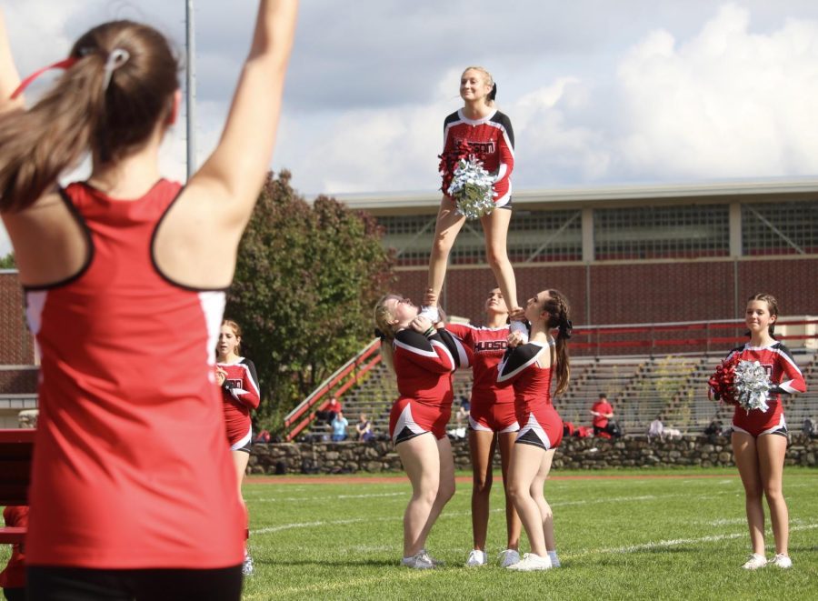 Varsity Cheer performing a stunt |by Ella Spuria
