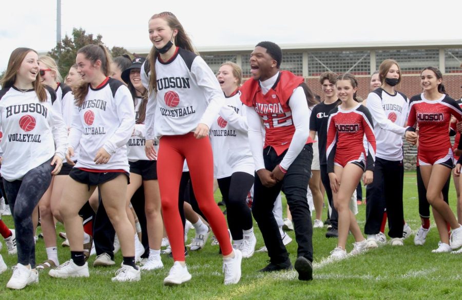 Varsity fall sports teams running to the stands |by Ella Spuria