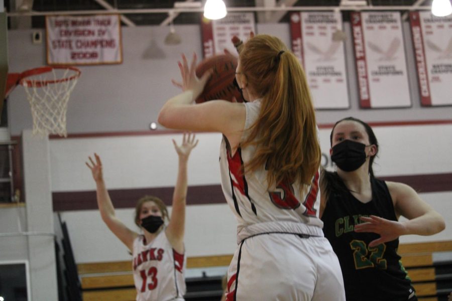 Mary Stefanski (32) shooting from the three-point line |by Brianna Devlin
