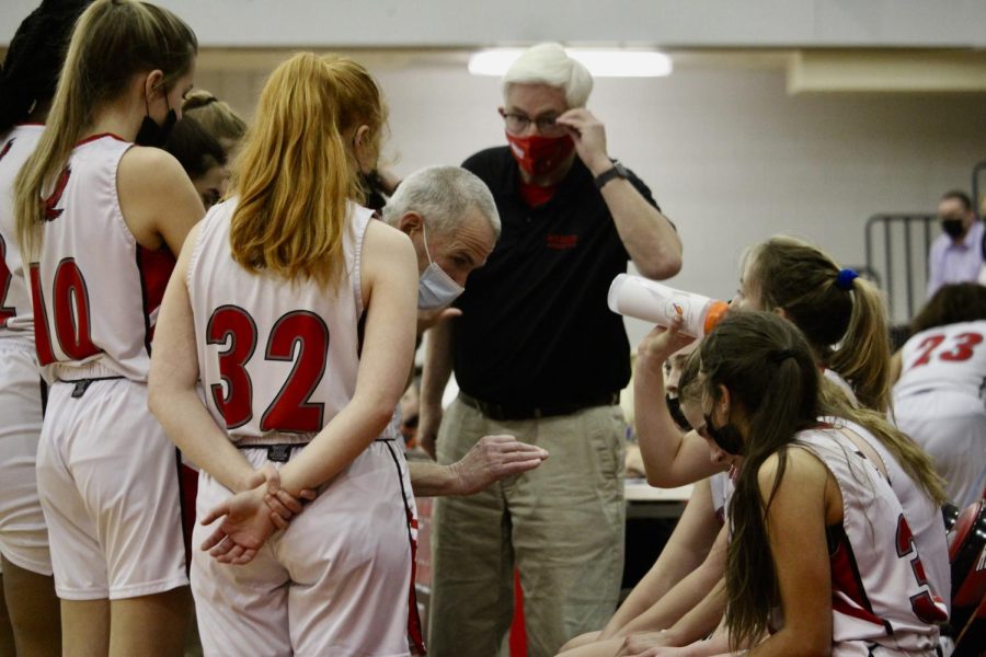 Team getting coached during timeout |by Ella Spuria