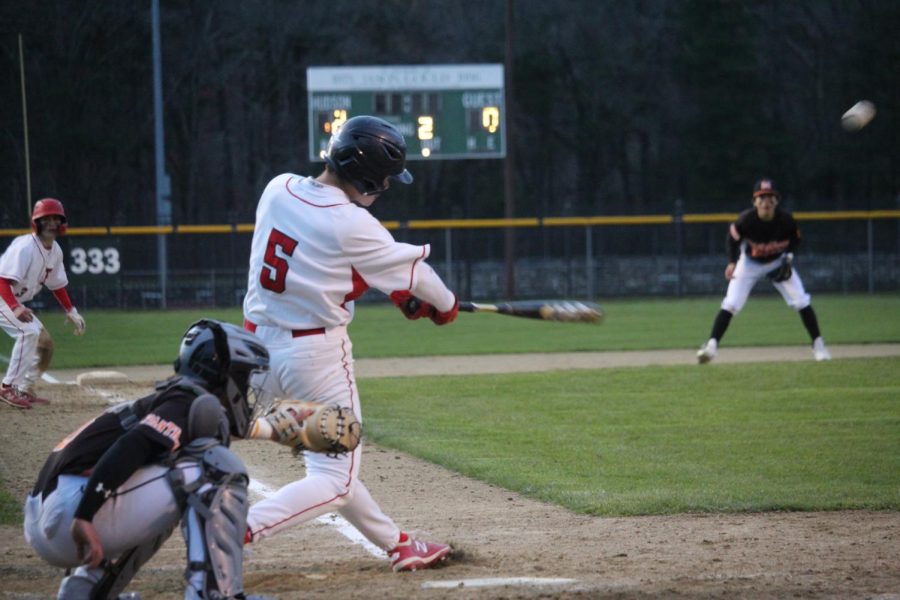 Bobby Long (5) swinging to hit |by Brianna Devlin