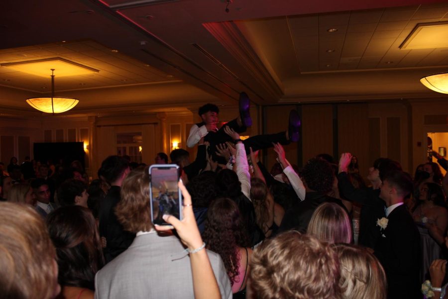Lucas Pessoni crowd surfing the dance floor |by Brianna Devlin
