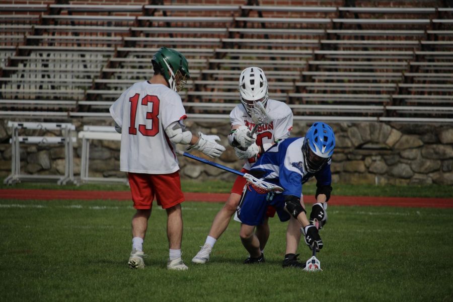 David Hoag (13) and Ryan Bailey (16) surrounding opponent |by Ella Spuria