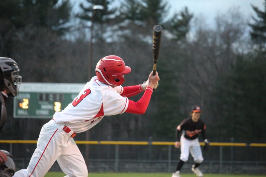 Jackson Sequenzia (3) lunging to hit the ball |by Brianna Devlin