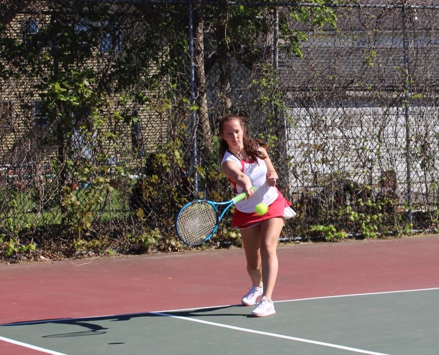 Allie Davis returns the ball with a forehand swing | by Olivia Downin