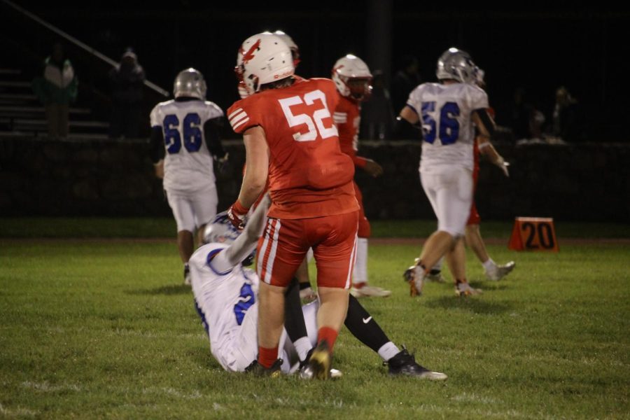 Captain Ryan Yates (52) helping up opponent |by Ella Spuria