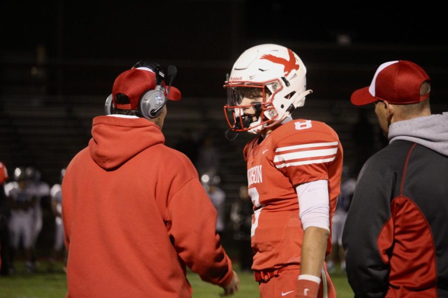 Assistant Coach Jake Wardwell with Jake Attaway (8) on the sidelines |by Ella Spuria