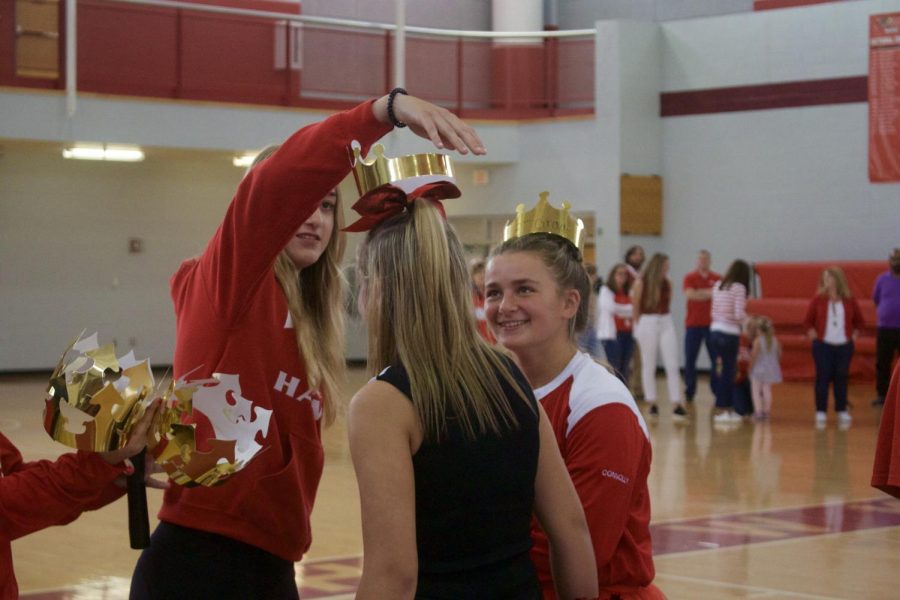 Maddie Kiley crowning Jane Yates and Olivia Conoly as 8th grade spirit queens | Alessandra Burnett