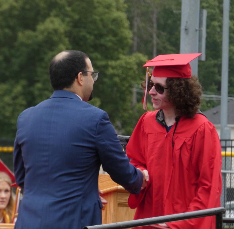 Foley William receiving diploma from Dr. Medeiros | Alex Cutler