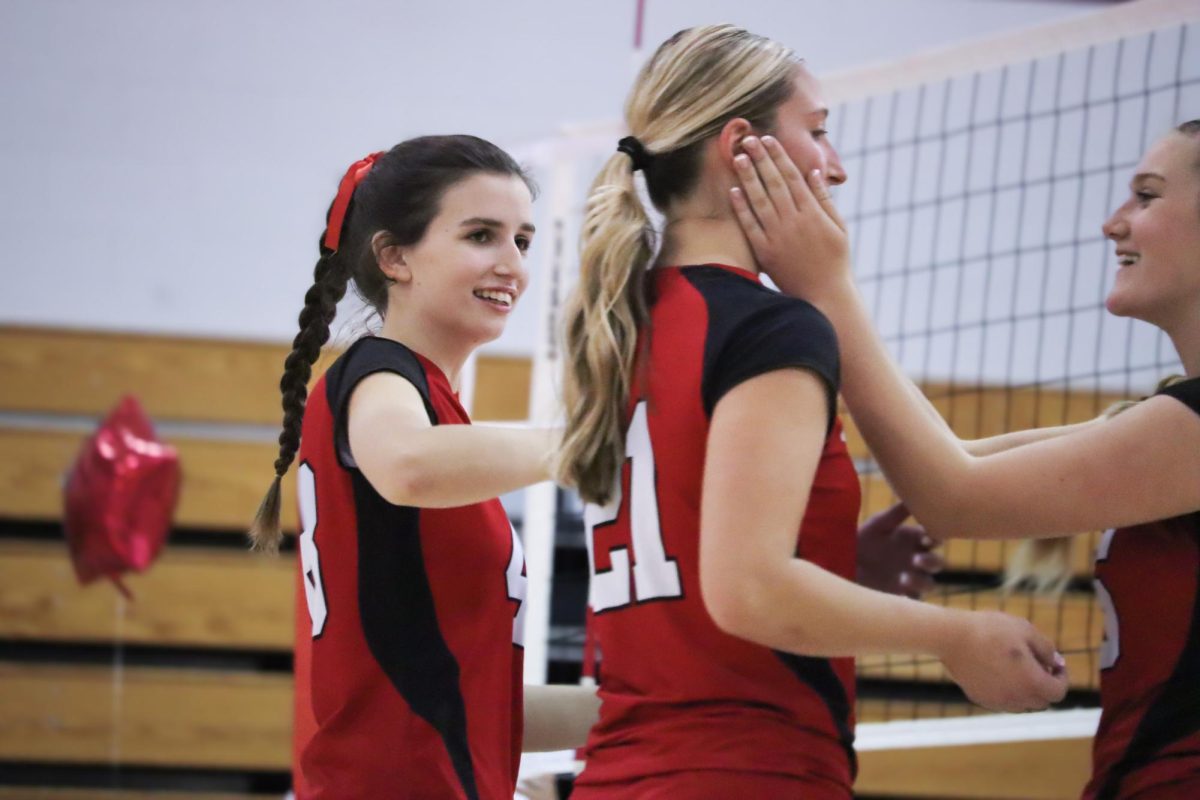 Captains Lauren Shurling (21) and Ally Cassidy (25), and Giada Collarullo (48) hype eachother up between sets |by Ella Spuria