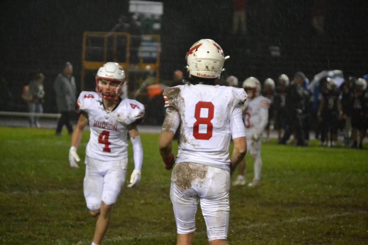 Captain Jake Attaway (8) and Ben Jackson (4) running on the field | by Jason Ford