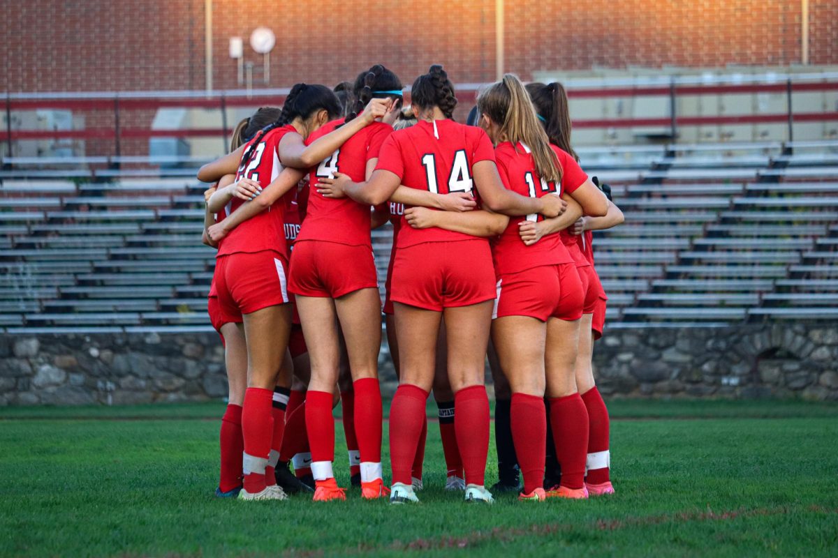 Team huddle before the start the game |by Ella Spuria