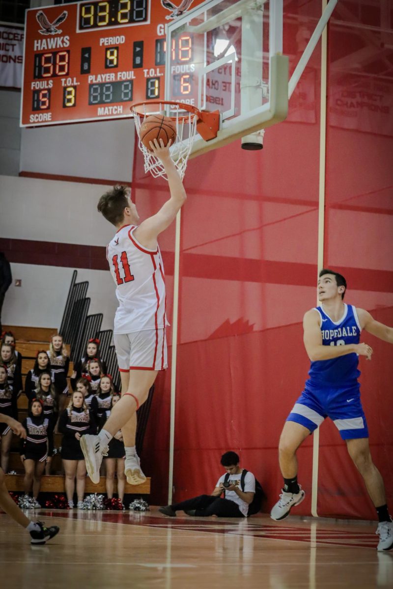Jackson OBrien going for the layup | by Ella Spuria 