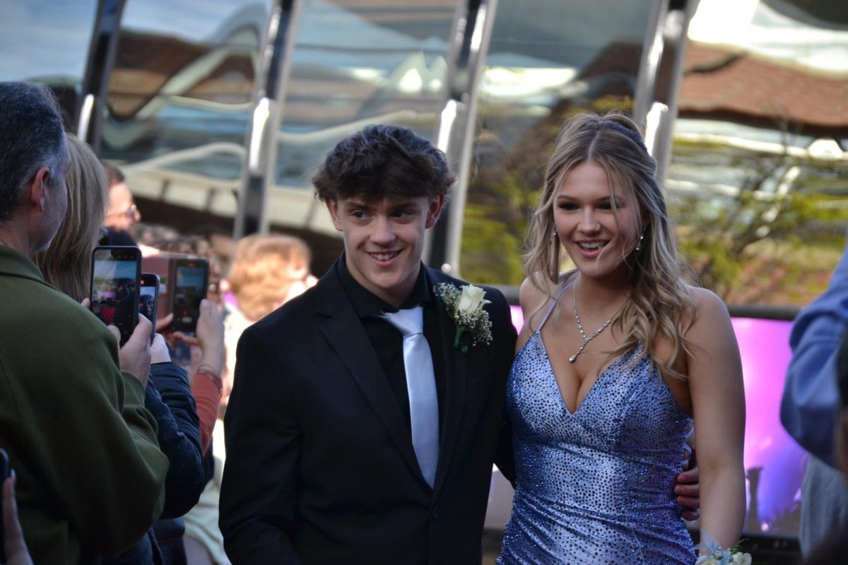 Vinny Martino walking with his date Macey Cooper |by Matthew Bruce