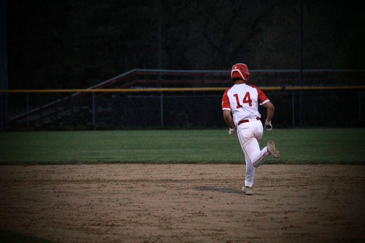 Caelen OBrien (14) running to second |by Andrew Oliveira 