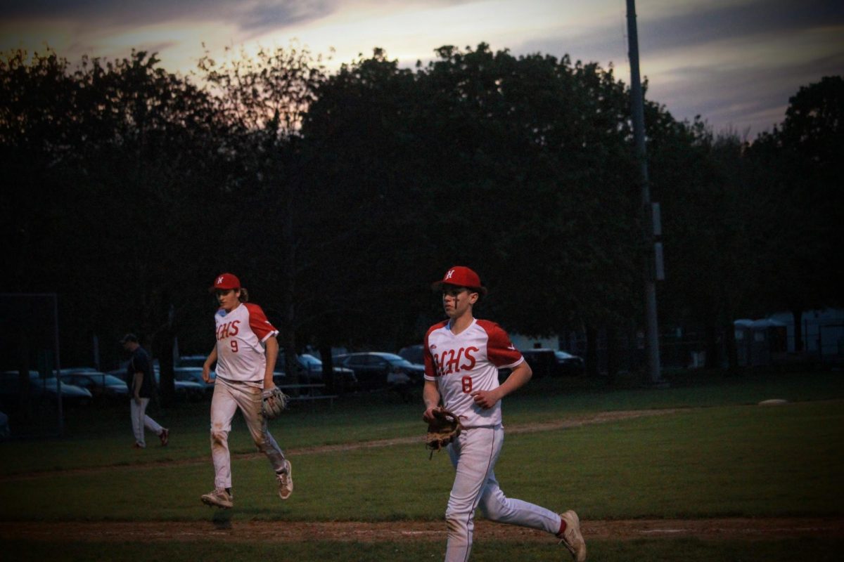 Blake Freitas (8) and Braeden Murphy (9) going to the dugout |by Andrew Oliveira 