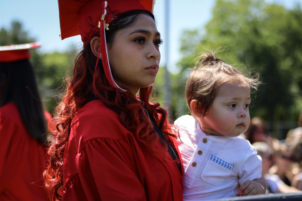 Paula Lima waits to walk the stage with her daughter |by Ella Spuria