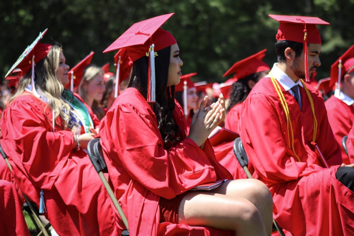 Graduates listen to their classmates speeches |by Ella Spuria
