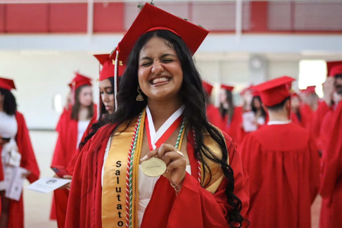 Salutatorian and Co-Editor-in-Chief of the Big Red Avani Kashalikar flexes her well deserved medal |by Ella Spuria