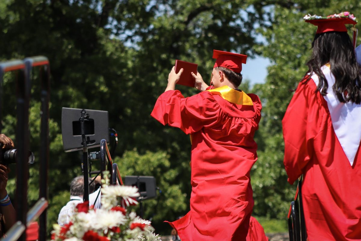 Class of 2024 Vice President Jackson OBrien shows off his diploma |by Ella Spuria
