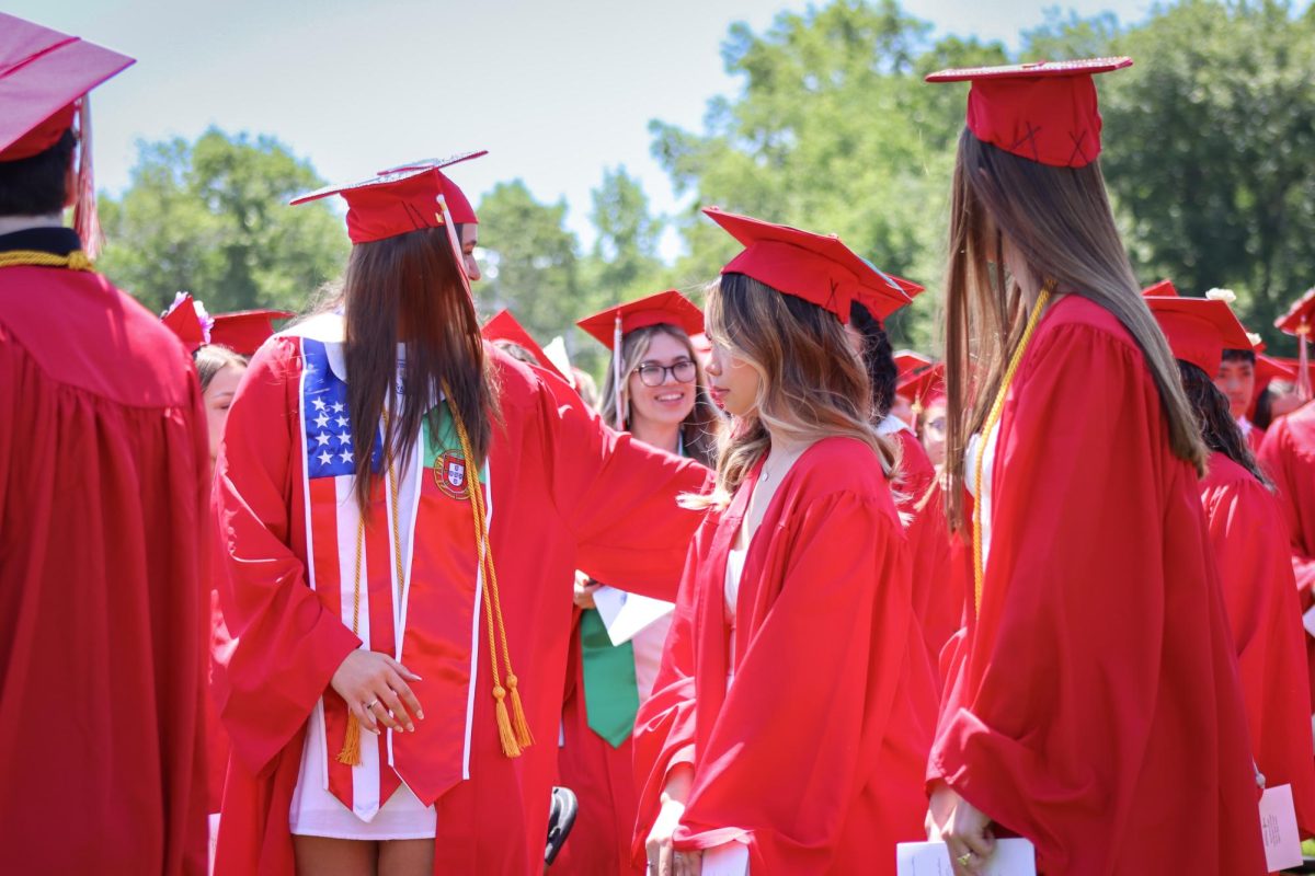 Seniors mingling before the ceremony begins |by Ella Spuria