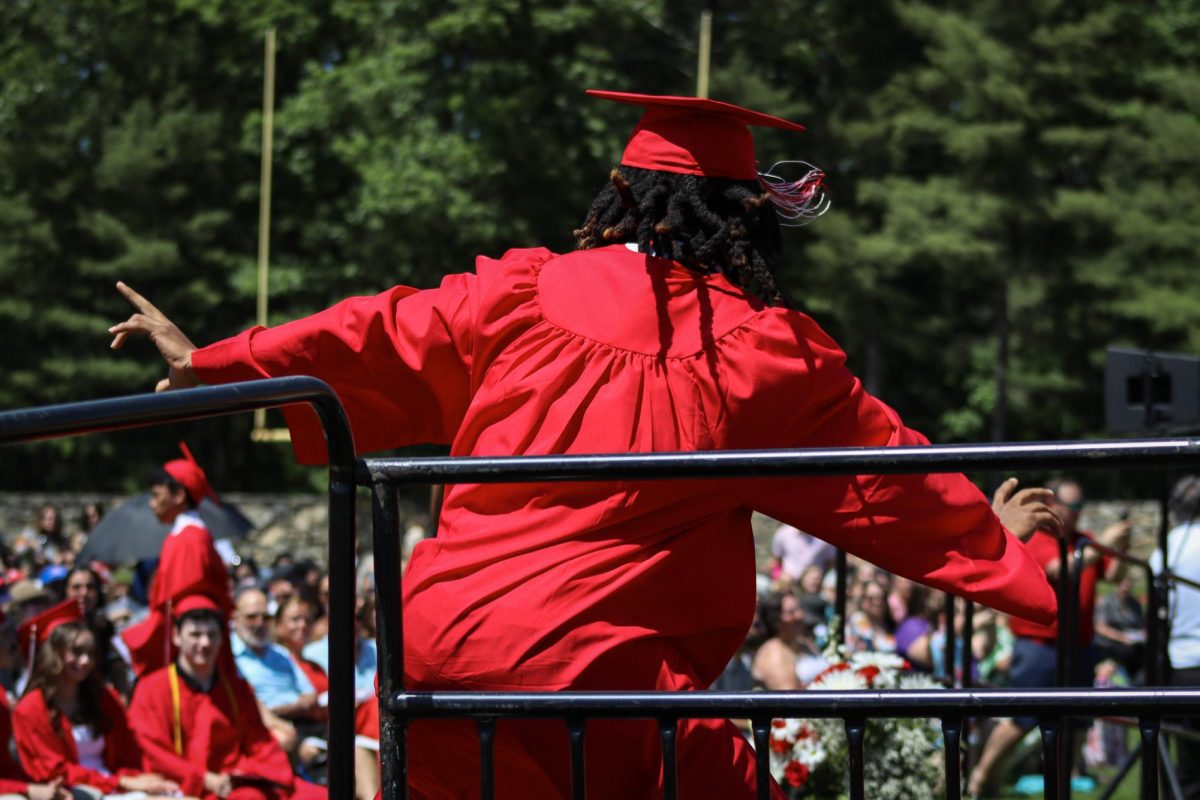 Aaron Horton gets down right before receiving his diploma |by Ella Spuria