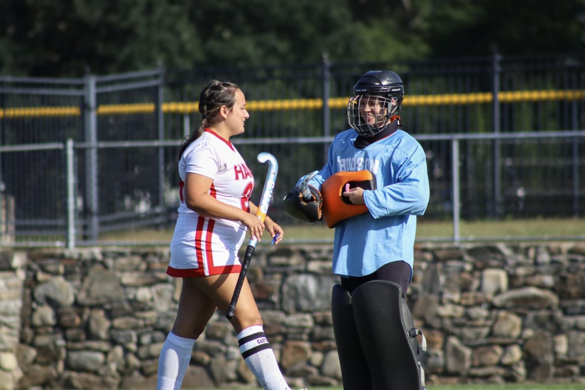 Captain Janie Brunelle (24) on defense with goalie Sophia Bater (33) between plays |by Ella Spuria