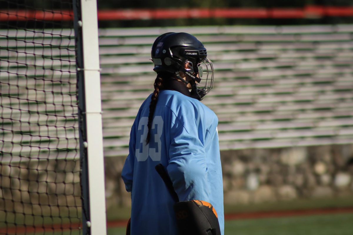 Sophia Bater (33), goalie, watches the play from her post |by Ella Spuria