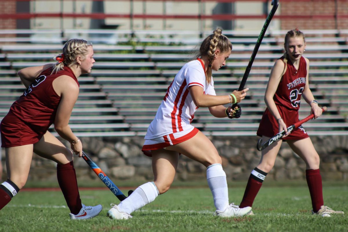 Liv Connolly (13) swings to pass the ball |by Ella Spuria