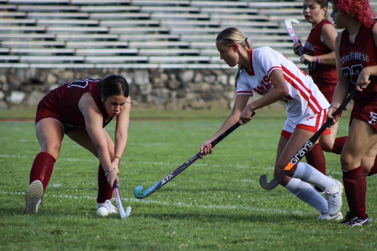 Emma Wood (10) attempts to get possession from Fitchburg |by Ella Spuria