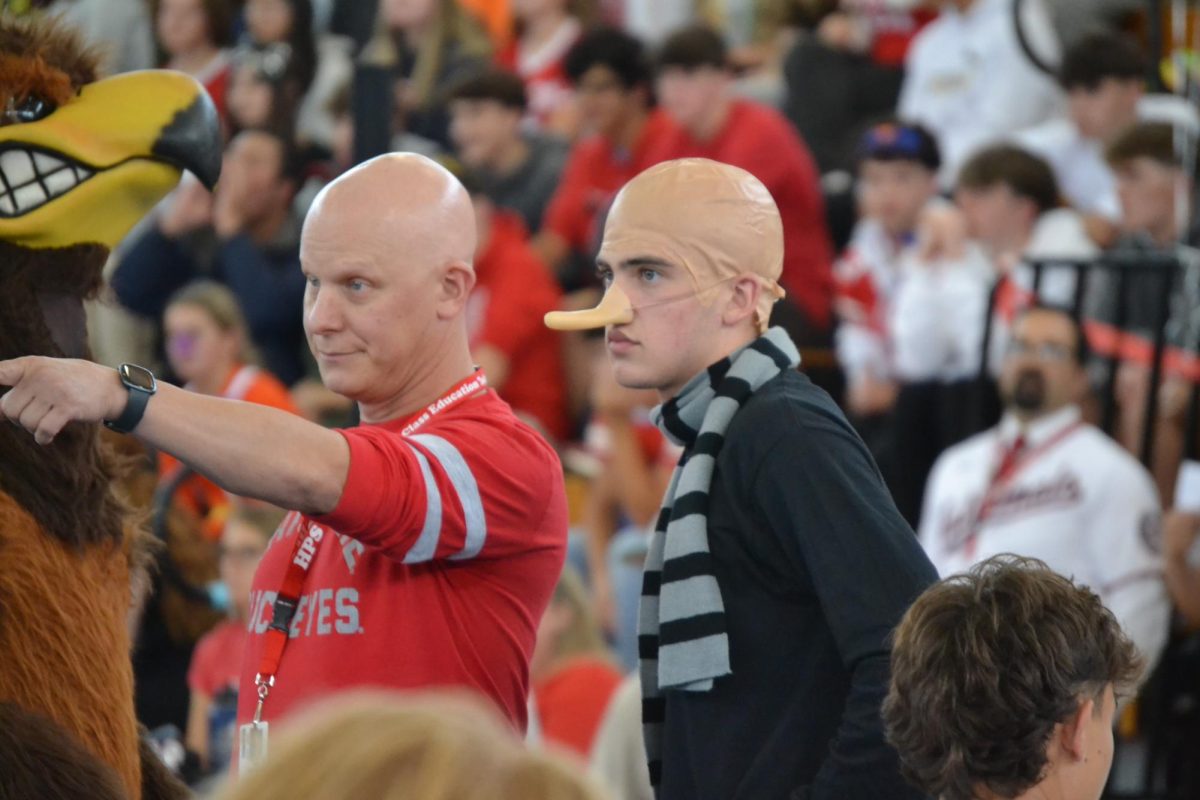 Senior Anthony Moura and history teacher Tim Reinhardt twinning | by Clarissa Lopes 