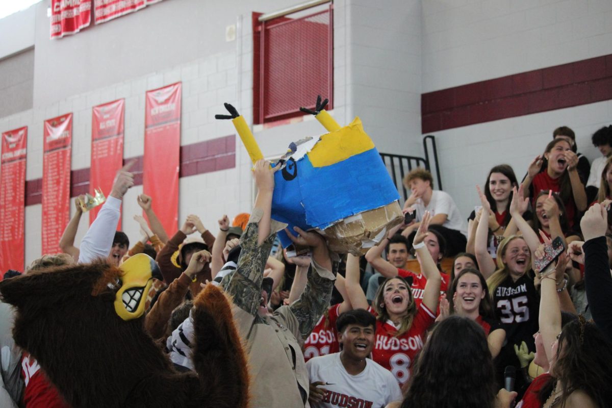 Seniors demolishing Minion costume from junior piñata | by Clarissa Lopes