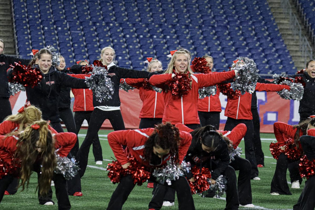 Varsity Cheerleading and Dance in their combined half-time routine |by Ella Spuria