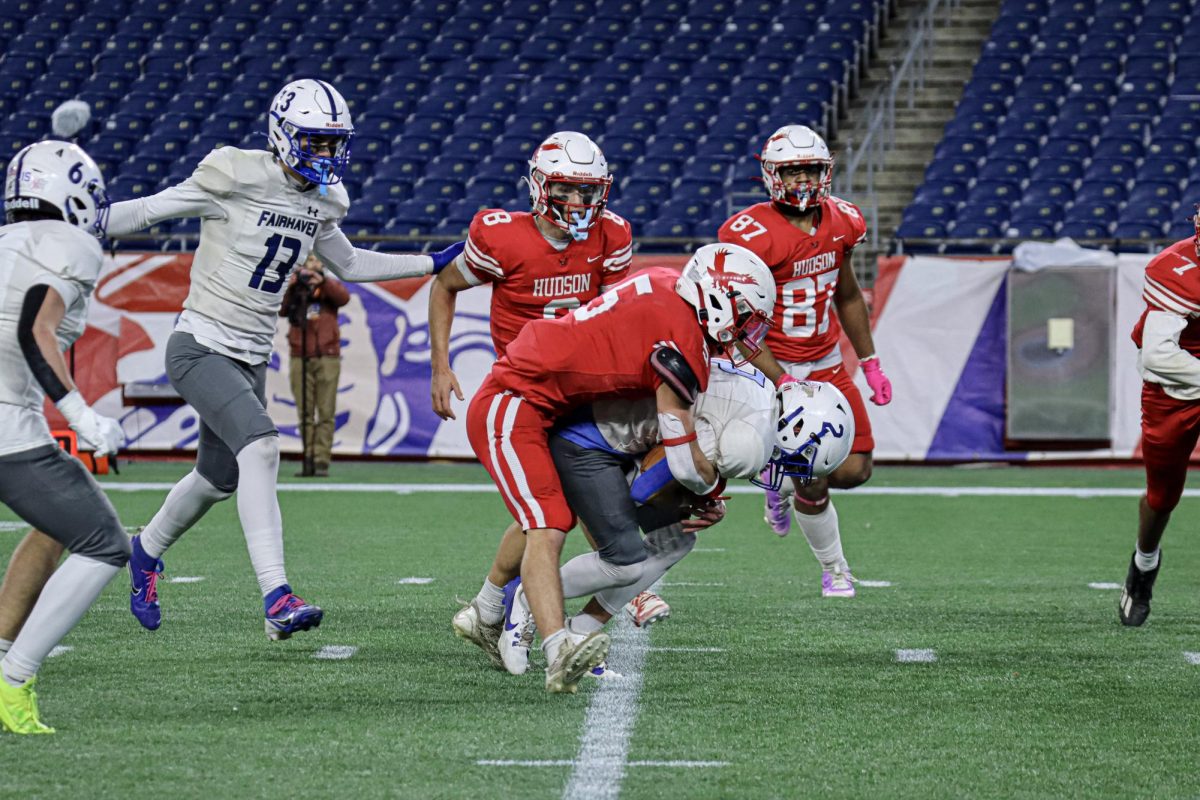 Captain Owen Nanartowich (5) tackles Fairhaven quarterback |by Ella Spuria