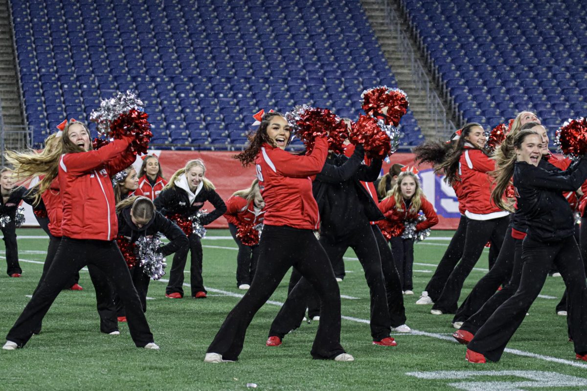 Varsity Cheerleading and Dance in their combined half-time routine |by Ella Spuria