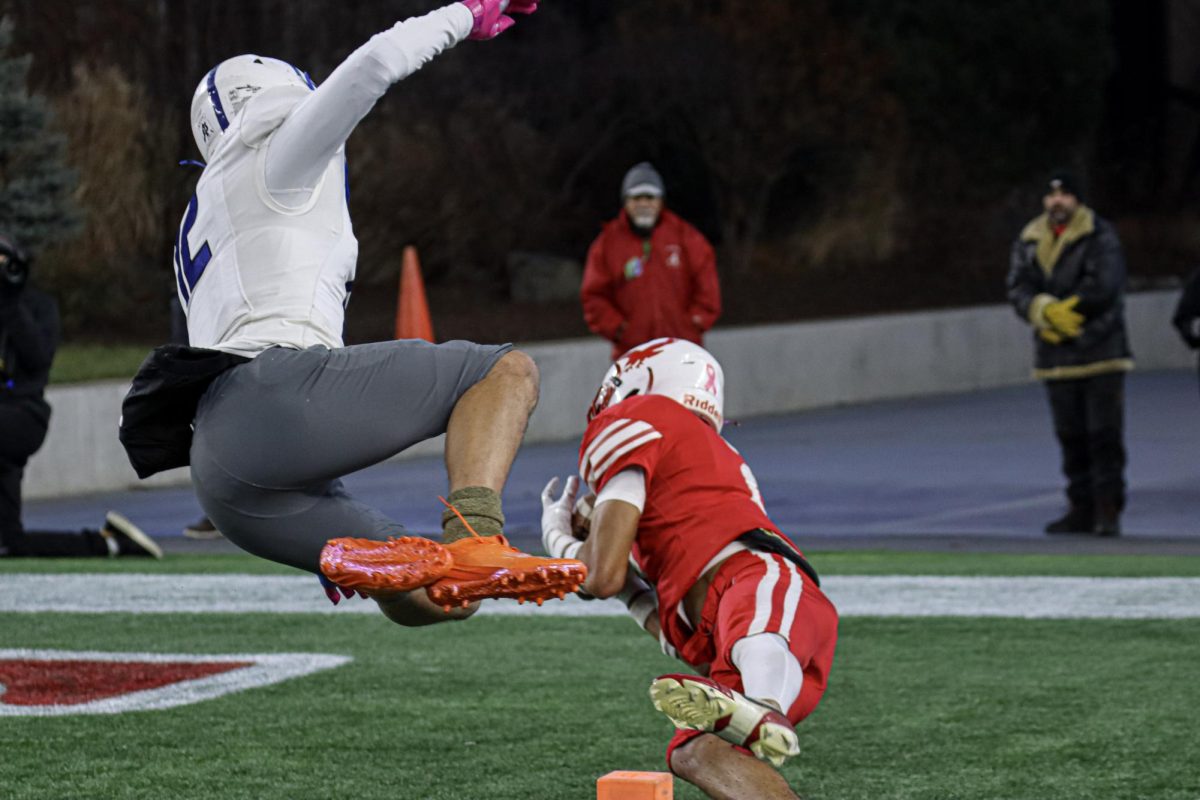 Successful pass by Savion Newton-Clark (2) from quarterback Logan Dome (36) earns the Hawks another touchdown |by Ella Spuria