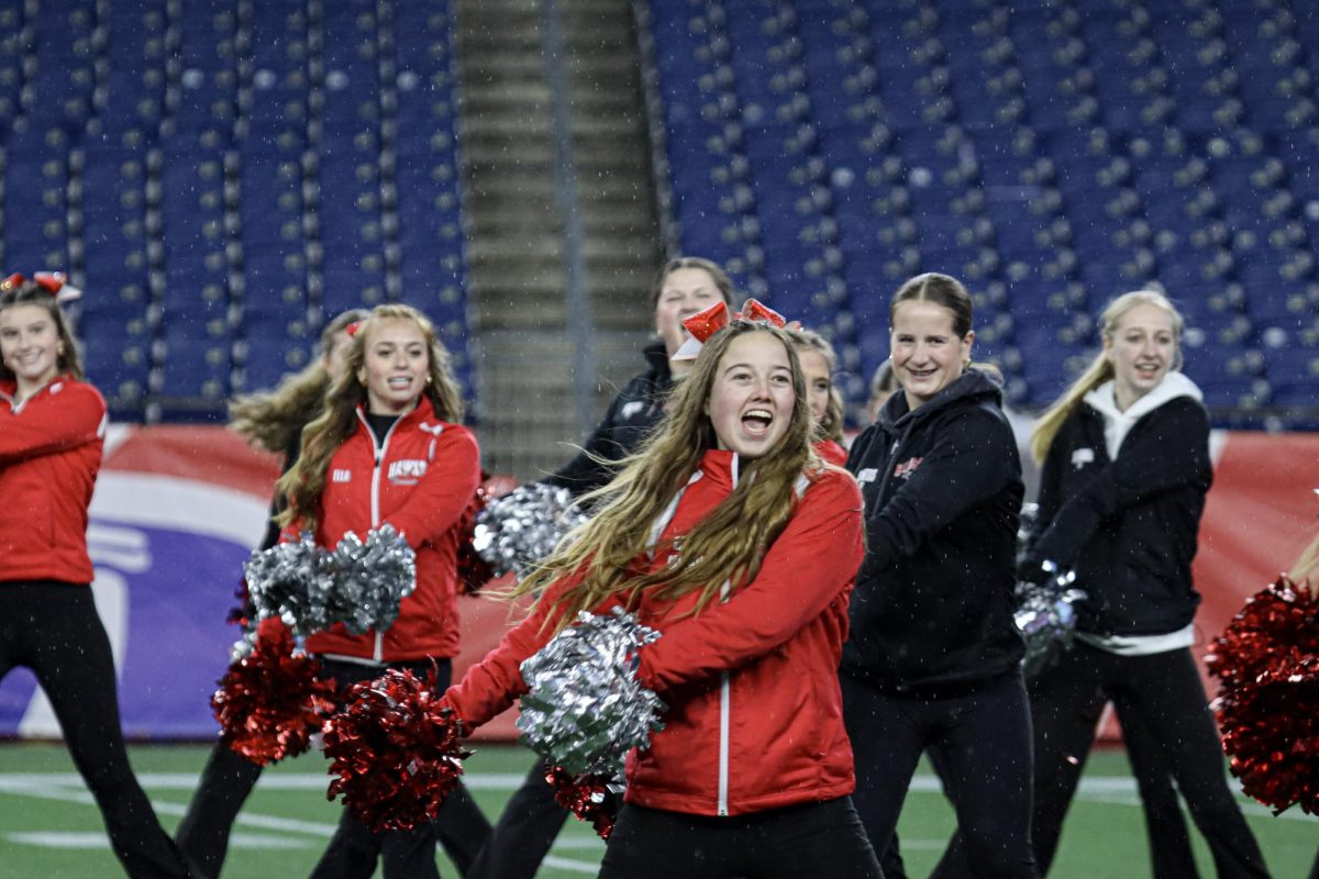 Senior Varsity Cheerleading Captain Kaylee Tryba leads her team in the halftime performance |by Ella Spuria