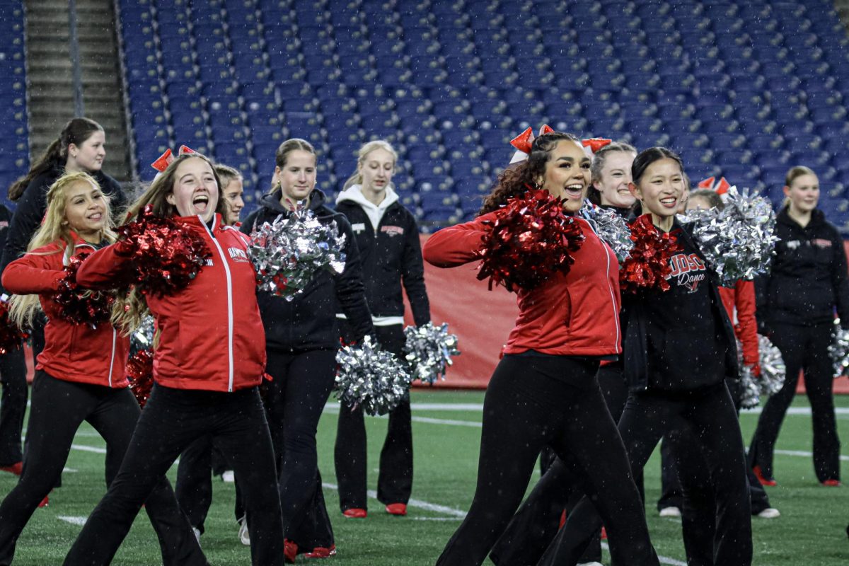 Varsity Cheerleading and Dance in their combined half-time routine |by Ella Spuria