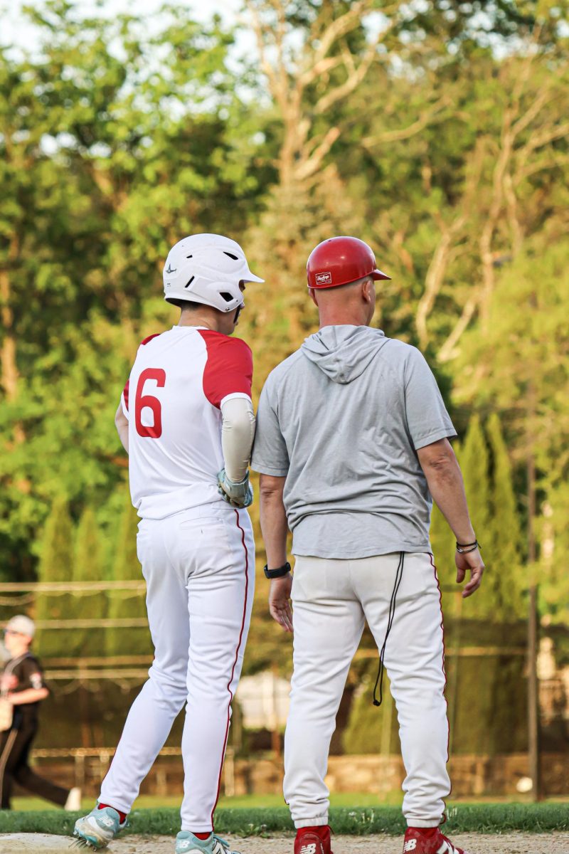 Blake Freitas (6) and Coach Reinhardt at second |by Ella Spuria