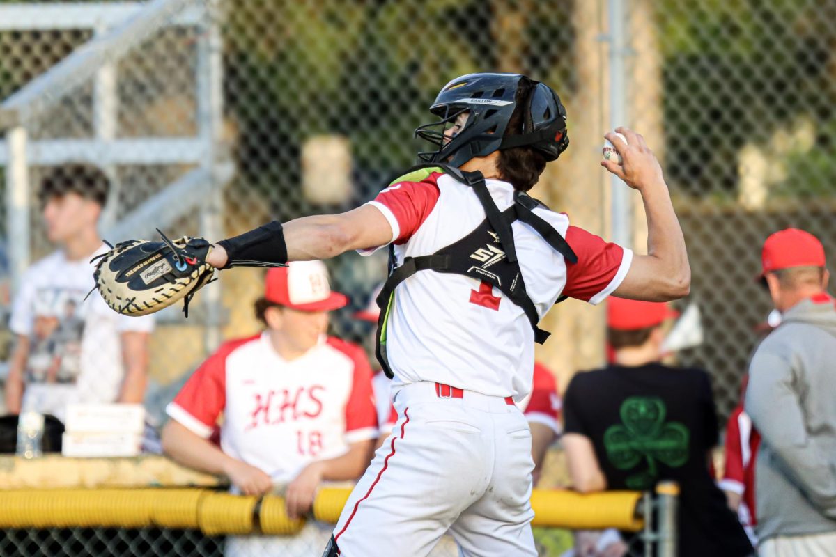 Logan Dome (1) returns the ball to pitcher |by Ella Spuria